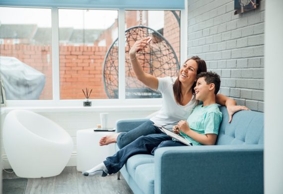 Mum and Son taking a selfie in their new conservatory