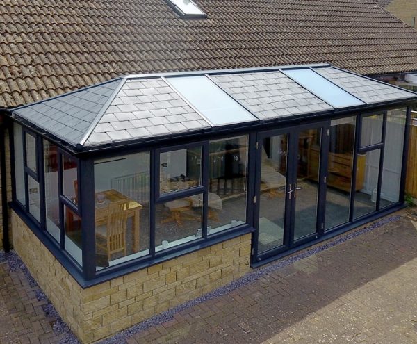 Shot of a blue conservatory attached to a home