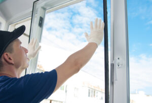 male worker installing a double-glazed window
