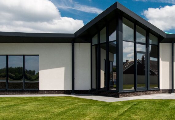 Aluminium entrance door with slim modern frame, high‑quality glazing and contemporary front‑door design.