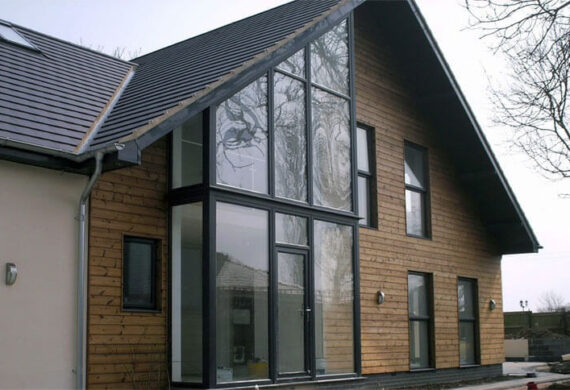 Modern aluminium front door with slim contemporary frame and high‑quality glazing.